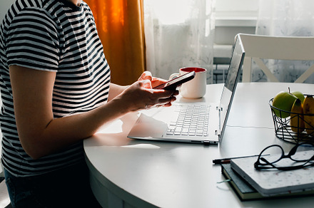 Female hands using phone and laptop. Lifestyle, small business concept. Selecti, a Person Photo by Anikona