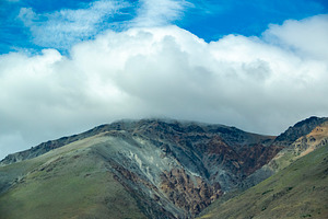 Rocky mountains covered by big clouds at top, chubut province, a, a Nature Photo by DanFLCreativo