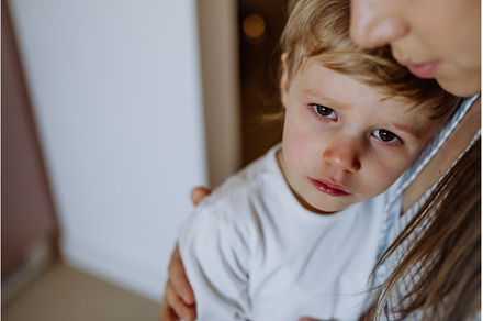 Mother consoling her little upset, a Person Photo by HalfPoint