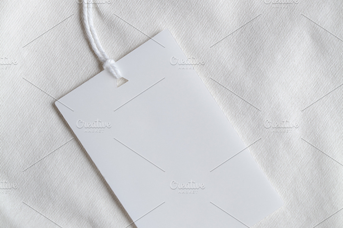Clothes label tag blank white mockup, an Advertising Mockup by Olha Klein (Photo 2 of 3)