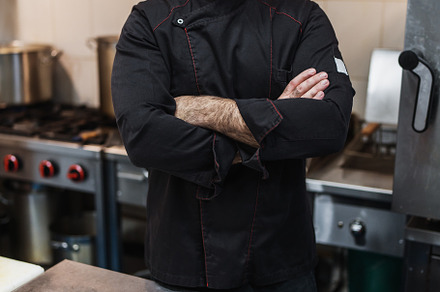 Professional chef preparing food, a Person Photo by REDDOT Studio