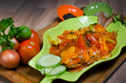 fried fish in a bowl with sauce, a Food & Drink Photo by bastera