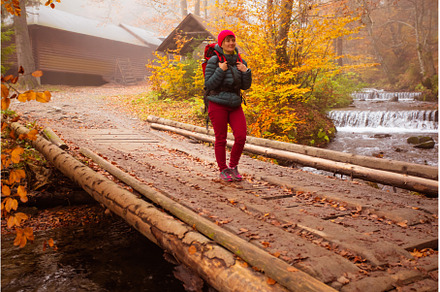 Woman is going across the wooden, a Person Photo by oksix