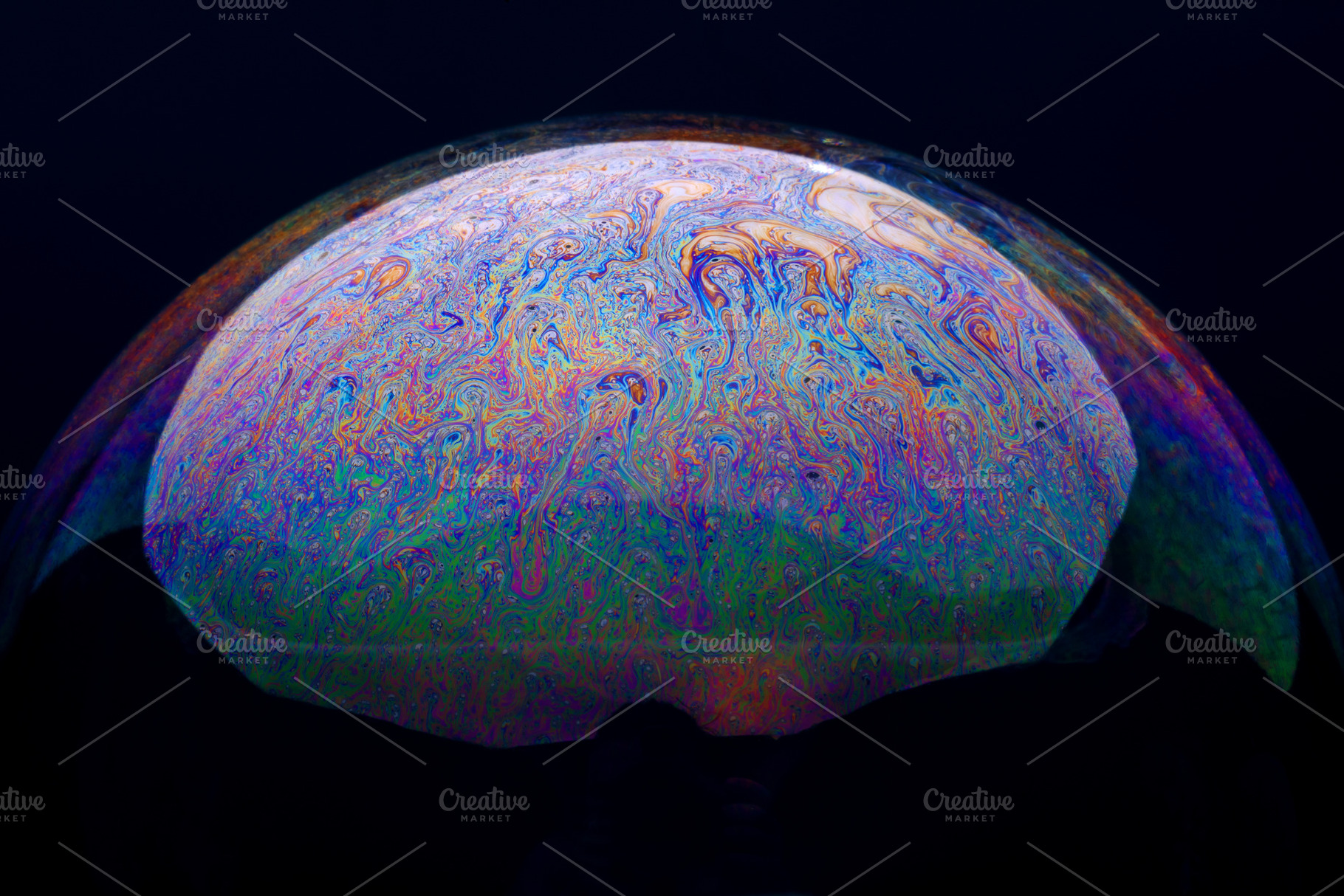 Vivid close-up of a soap bubble surface, showcasing swirling rai, an Abstract Photo by Ales Munt
