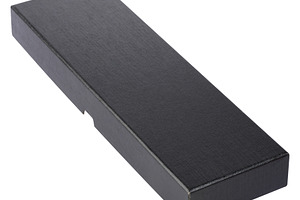 Closed long rectangular black box with textured surface on isola, an Abstract Photo by ndanko