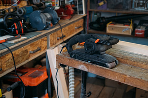 Carpentry equipment belt sander woodworking tool, an Industrial Photo by Photo Drive Studio