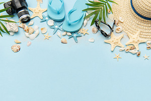 Summer accessories creating a frame on light blue background wit, a Holiday Photo by Olena Rudo