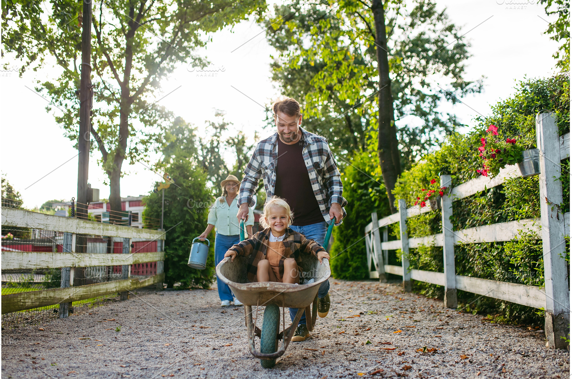 Father pushing toddler boy in, a Holiday Photo by HalfPoint