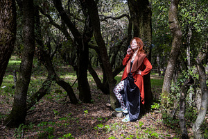 Redhead woman in a long red cardigan, a Person Photo by Imaginarium