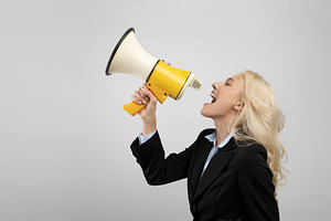 Announcement concept. Businesswoman shouting with megaphone in hands, sharing n, a Photo by Prostock-Studio