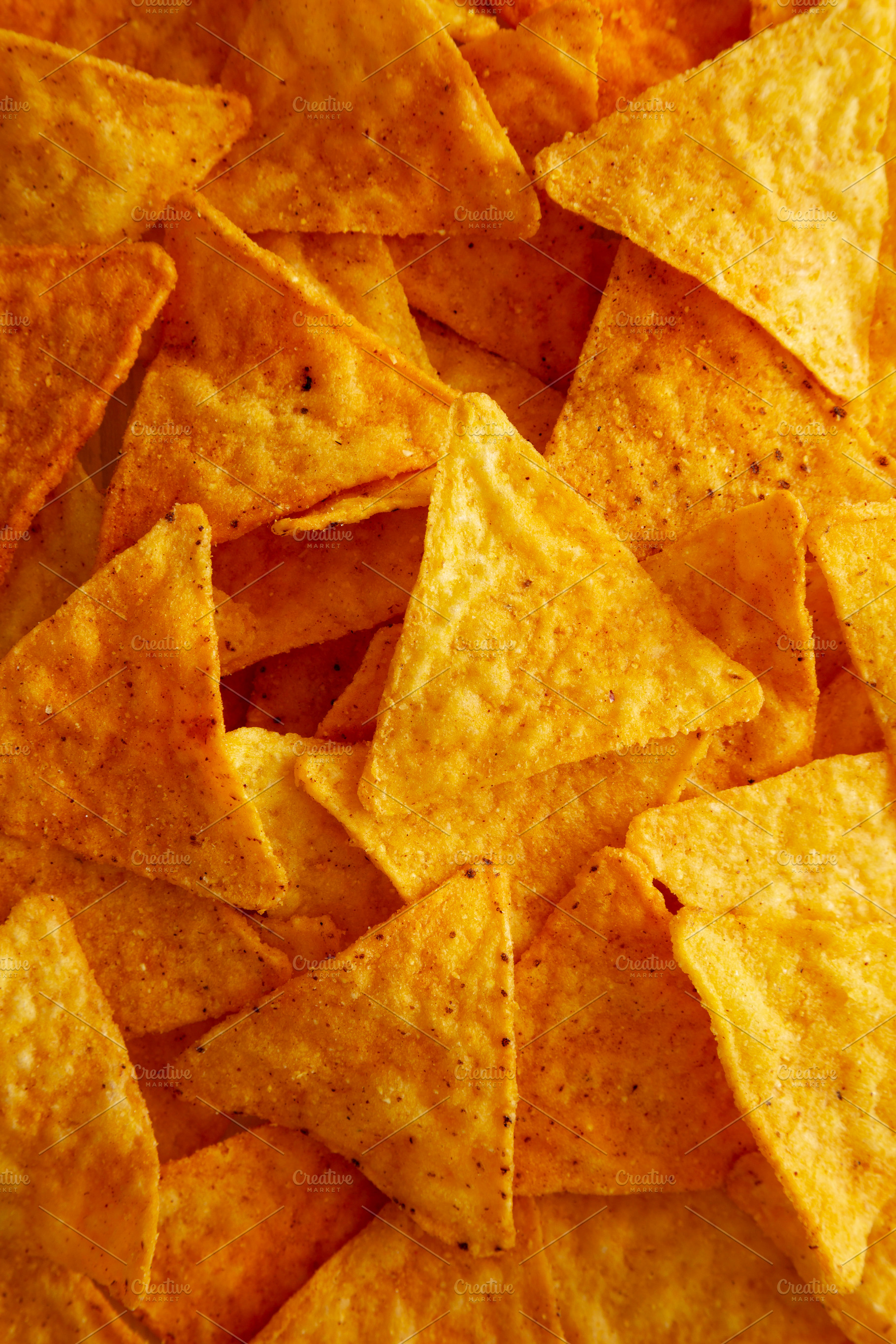 Crunchy Nacho BBQ Tortilla Chips, top view., a Food & Drink Photo by LiudmylaChuhunova
