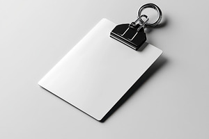 Blank White Clipboard with Metal Cli, a Background Photo by Pixeness Studio