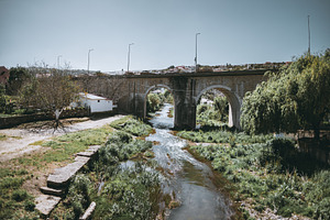 Stone bridge over countryside river, an Architecture Photo by SkyNext