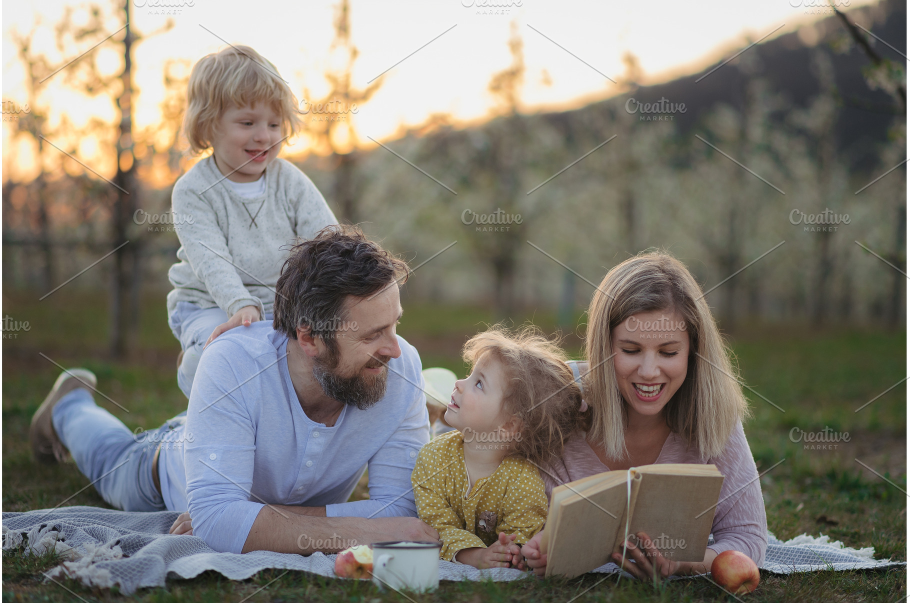 Family having picnic in spring, a Person Photo by HalfPoint