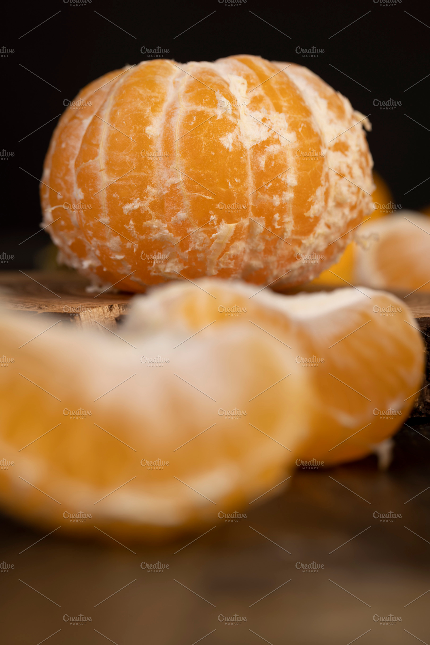 tangerines on the table, a group of peeled tangerines with juicy flesh closeup,, a Photo by rsoollAI