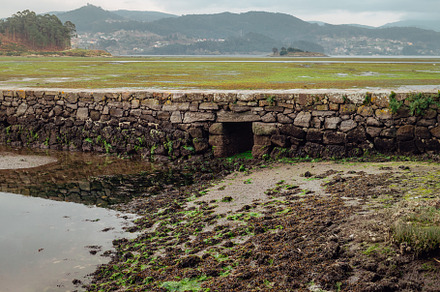 Roman bridge with a water door on an abandoned salt flats, a Nature Photo by rubenchase