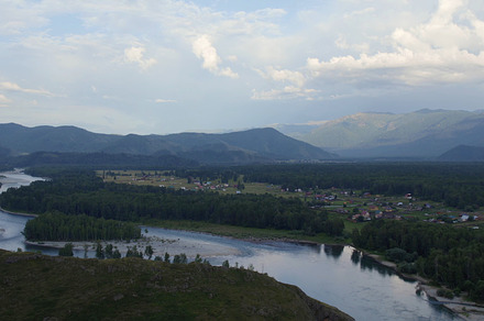 Majestic river Katun in valley of Altai under dramatic sky, a Nature Photo by TravelFlow