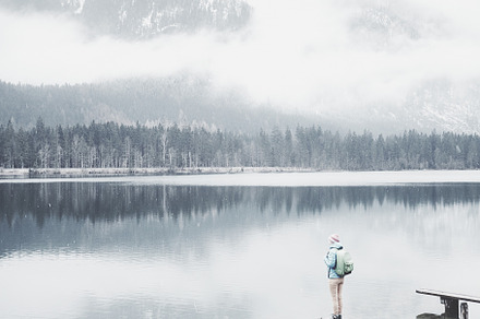 Tourist at winter mountain lake featuring active, activity, and adventure, a Nature Photo by Sergey Furtaev