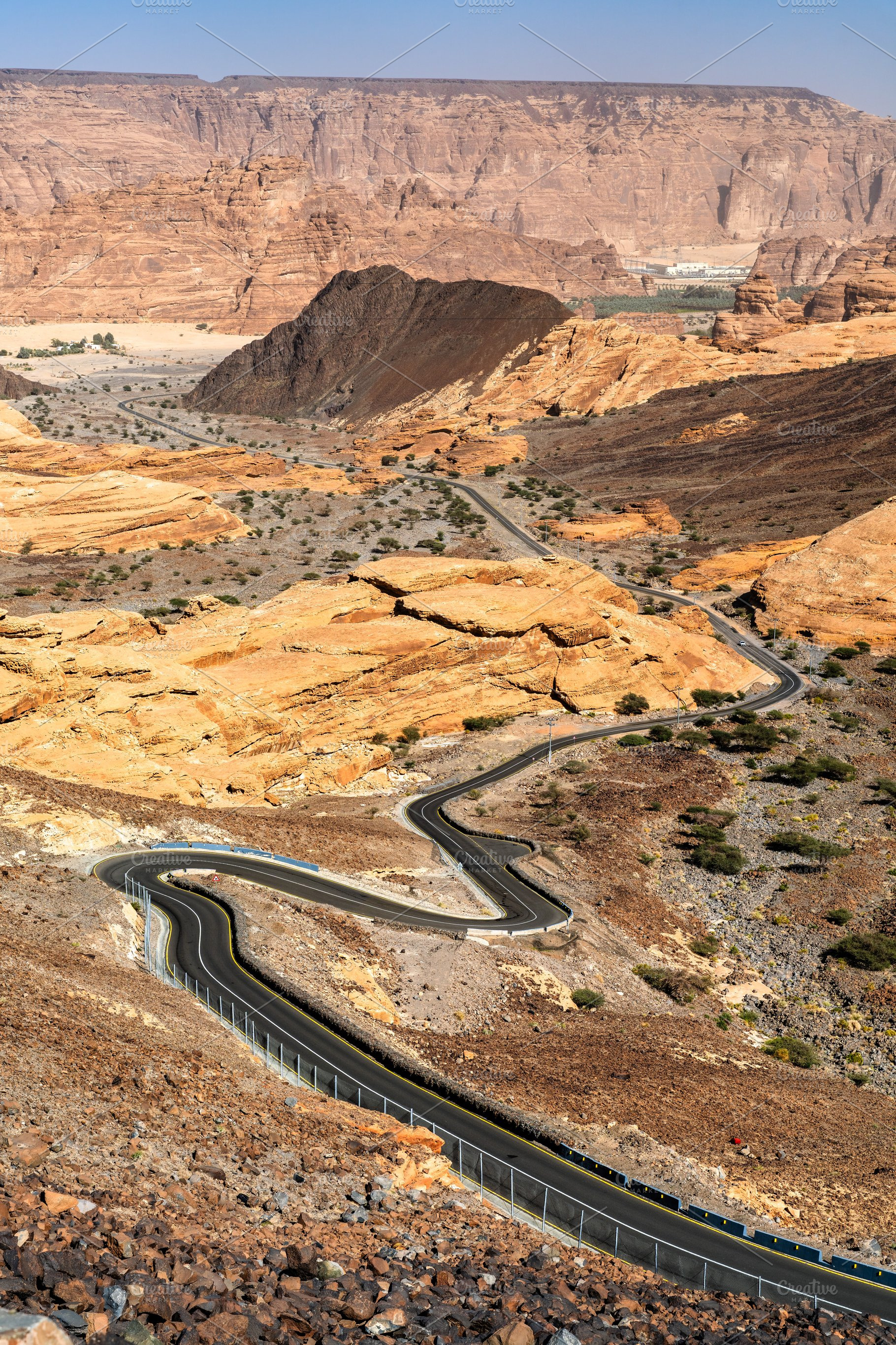 Winding desert road through the mountains of AlUla Saudi Arabia, a Nature Photo by Leonid Andronov