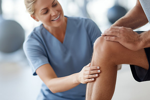 Physiotherapist assisting patient, a Sports & Recreation Photo by MistyDay