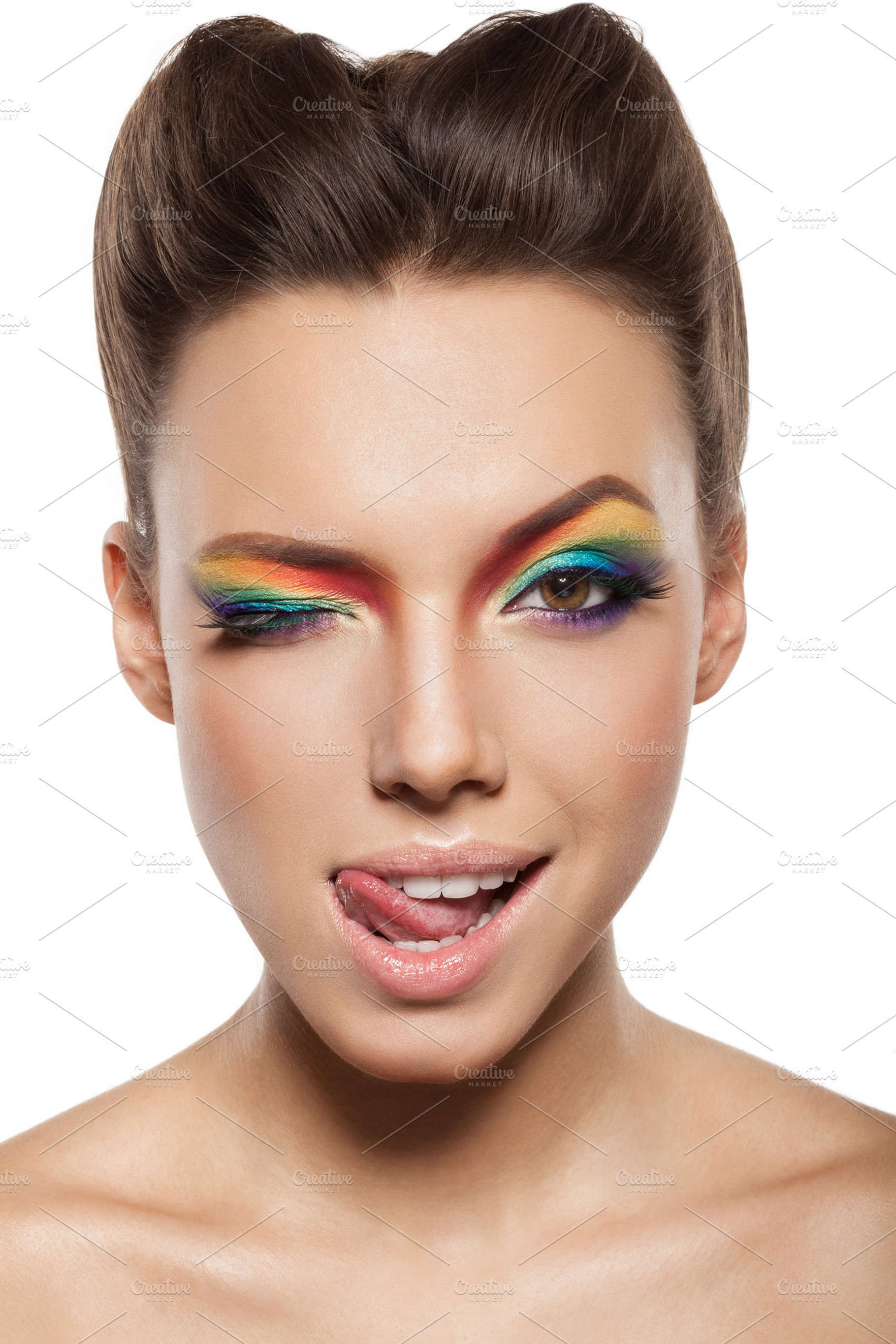 Female face with rainbow makeup containing beautiful, woman, and clean, a Beauty & Fashion Photo by Aliaksei Kaponia