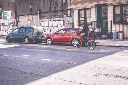 Woman Riding a Bike, Brooklyn Street