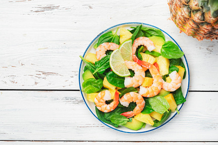 Pineapple shrimp salad with spinach, avocado and lime on white w, a Food & Drink Photo by 5PH