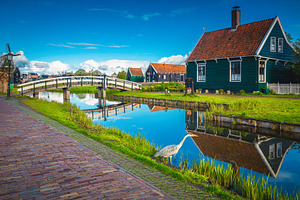 Cozy wooden houses in Zaanse Schans, an Architecture Photo by Alpine Dreams