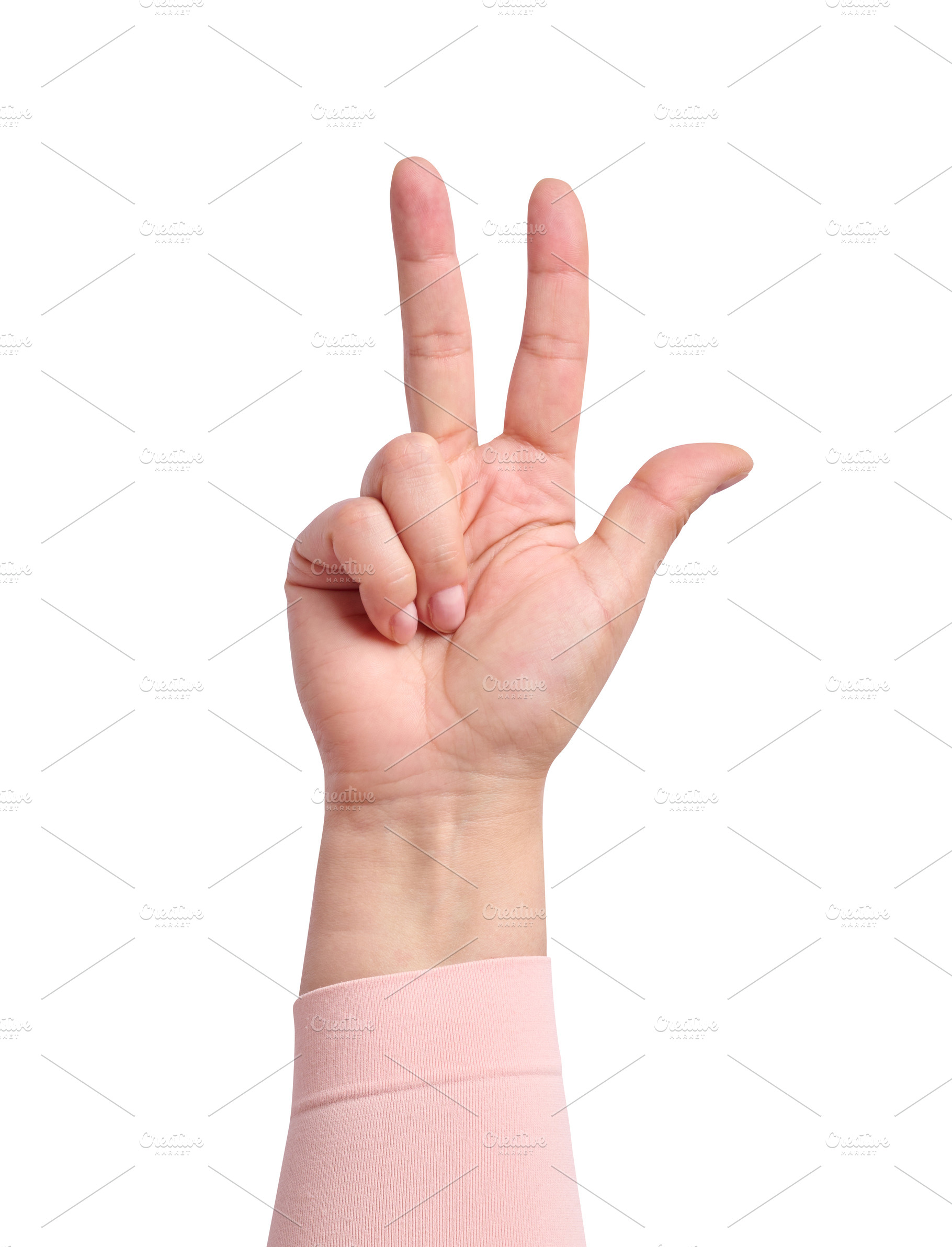A woman's hand in a pink sleeve shows a gesture with three finge, a Person Photo by ndanko