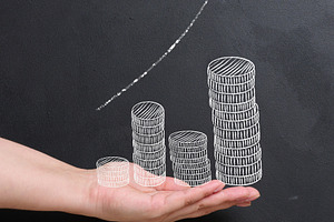A man's palm holds a stack of coins. Concept of financial growth, a Business Photo by ndanko