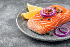 On a grey table, a serving of salmon, a Food & Drink Photo by ZinetroN