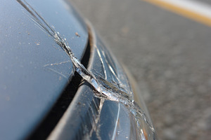 Close-up of a cracked car bumper, a Transportation Photo by AlyaAnd