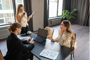 Businesswomen in a stylish office, a Business Photo by undrey