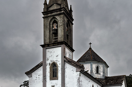 Old church with bell tower on a clou, an Architecture Photo by Perpis