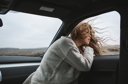 beautiful girl with long windy hair, a Person Photo by Aliaksei Kaponia