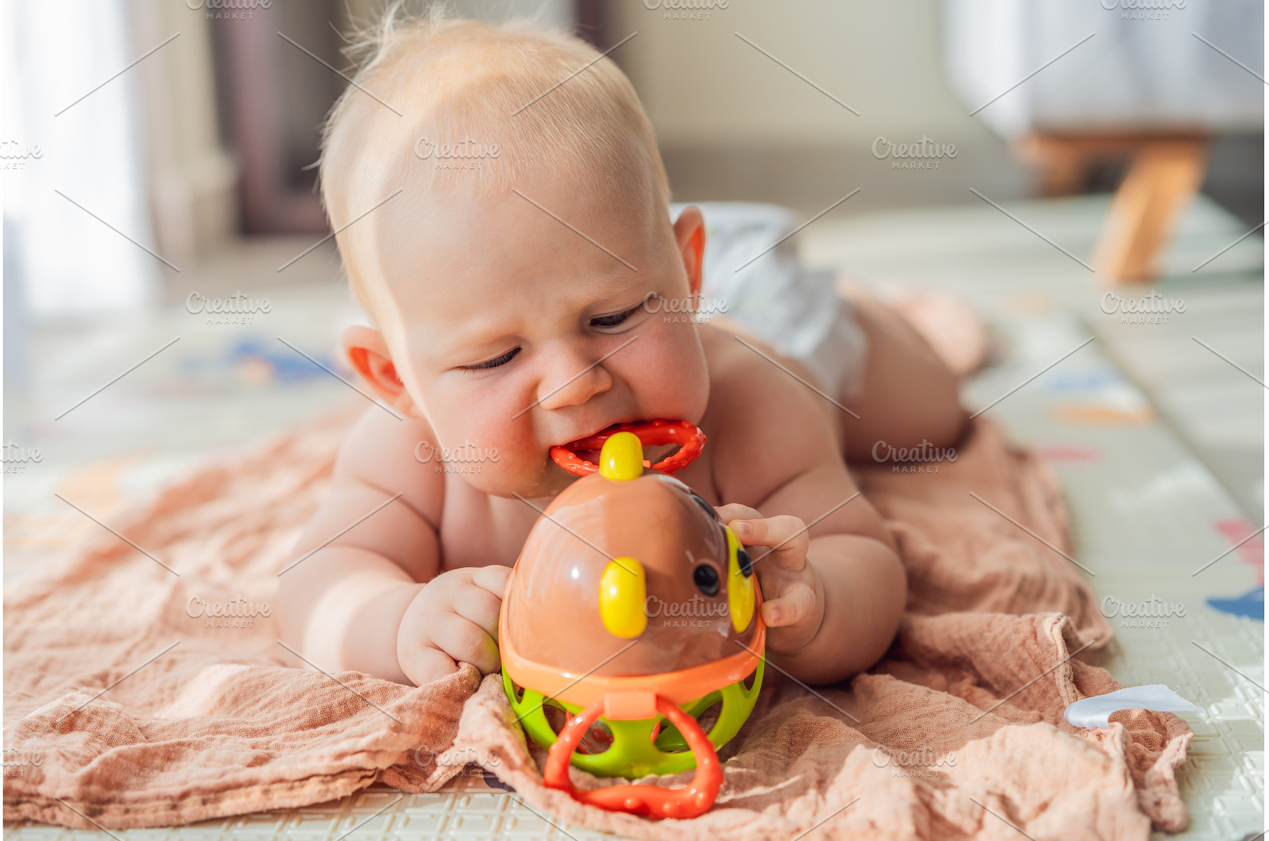Little baby playing with toys on a, a School & Education Photo by Elizaveta Galitskaya