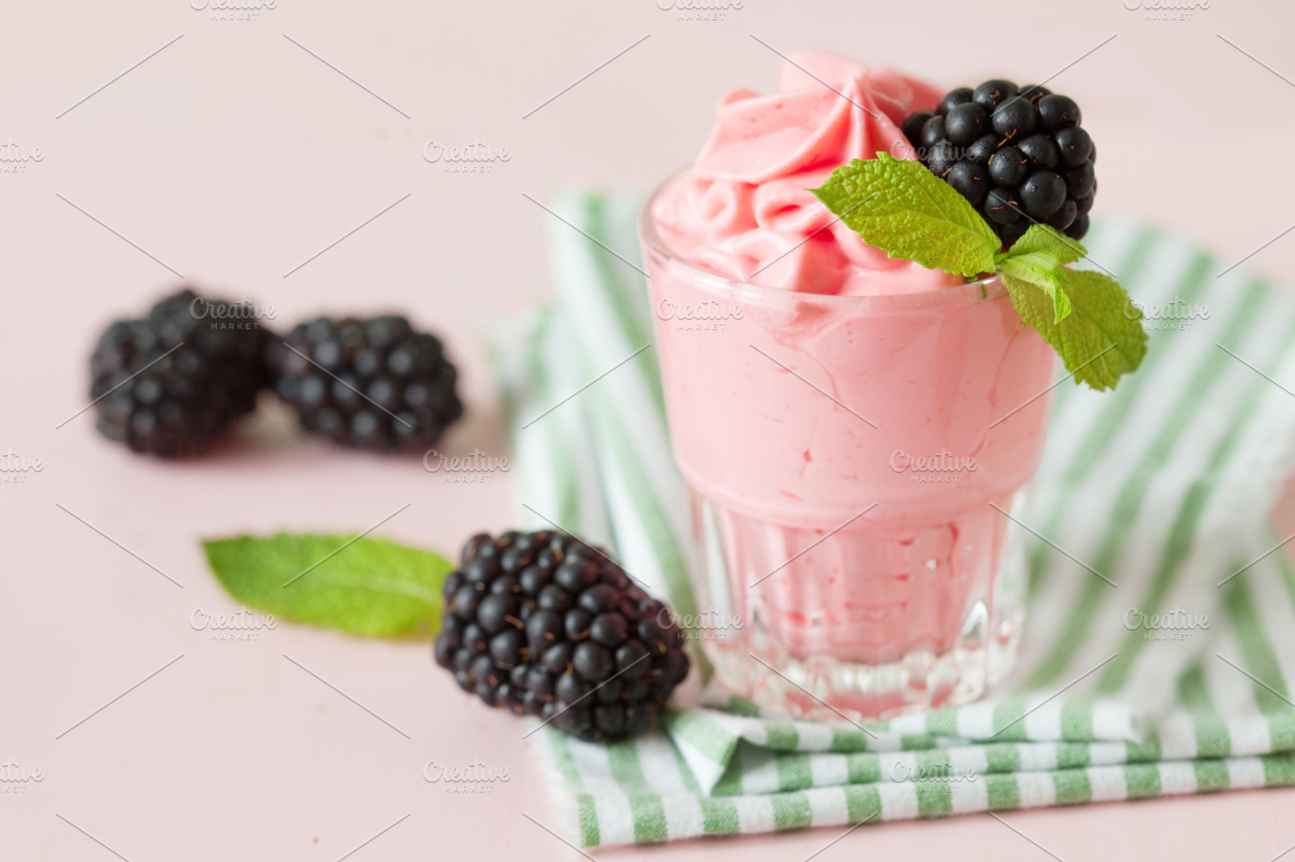 Raspberry ice cream containing cream, ice cream, and topping, a Food & Drink Photo by marikasan