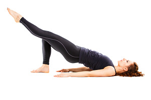 Young fit woman doing pilates on white background containing pilates, woman