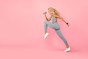 Young Woman Exercising With Dumbbells Isolated On Pastel Background, a Photo by Prostock-Studio (Thumbnail 2 of 2)