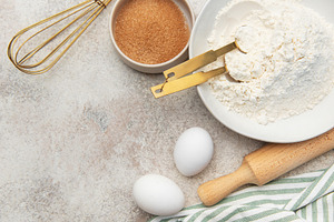 Baking ingredients preparing dough on kitchen counter, a Food & Drink Photo by Olena Rudo
