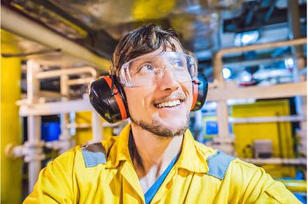 Young man in a yellow work uniform, a Person Photo by Elizaveta Galitskaya