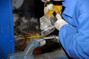 Worker Grinding Metal with Angle Grinder Sparks, an Industrial Photo by Davizro's Market