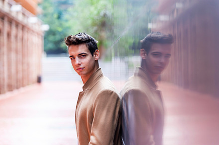Portrait of stylish handsome young man with coat standing outdoo, a Person Photo by RF Images