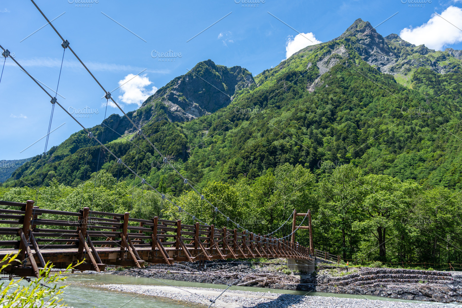 Myojin Bridge and mountains along Kamikochi hiking trail, Japan, a Nature Photo by GoodGoods