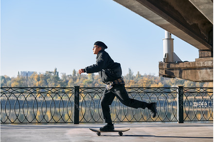 Skater rides on skateboard at empty, a Person Photo by Gladkov photography