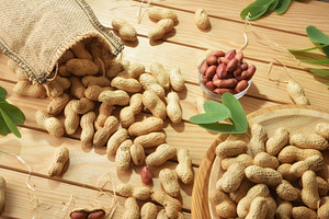 Wooden table with containers filled with freshly picked peanuts, a Food & Drink Photo by Davizro's Market