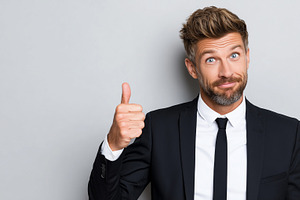 Confident man in black suit showing, a Business Photo by MistyDay