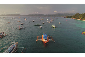 Bangka boats crowding the sea of, a Nature Photo by Goinyk