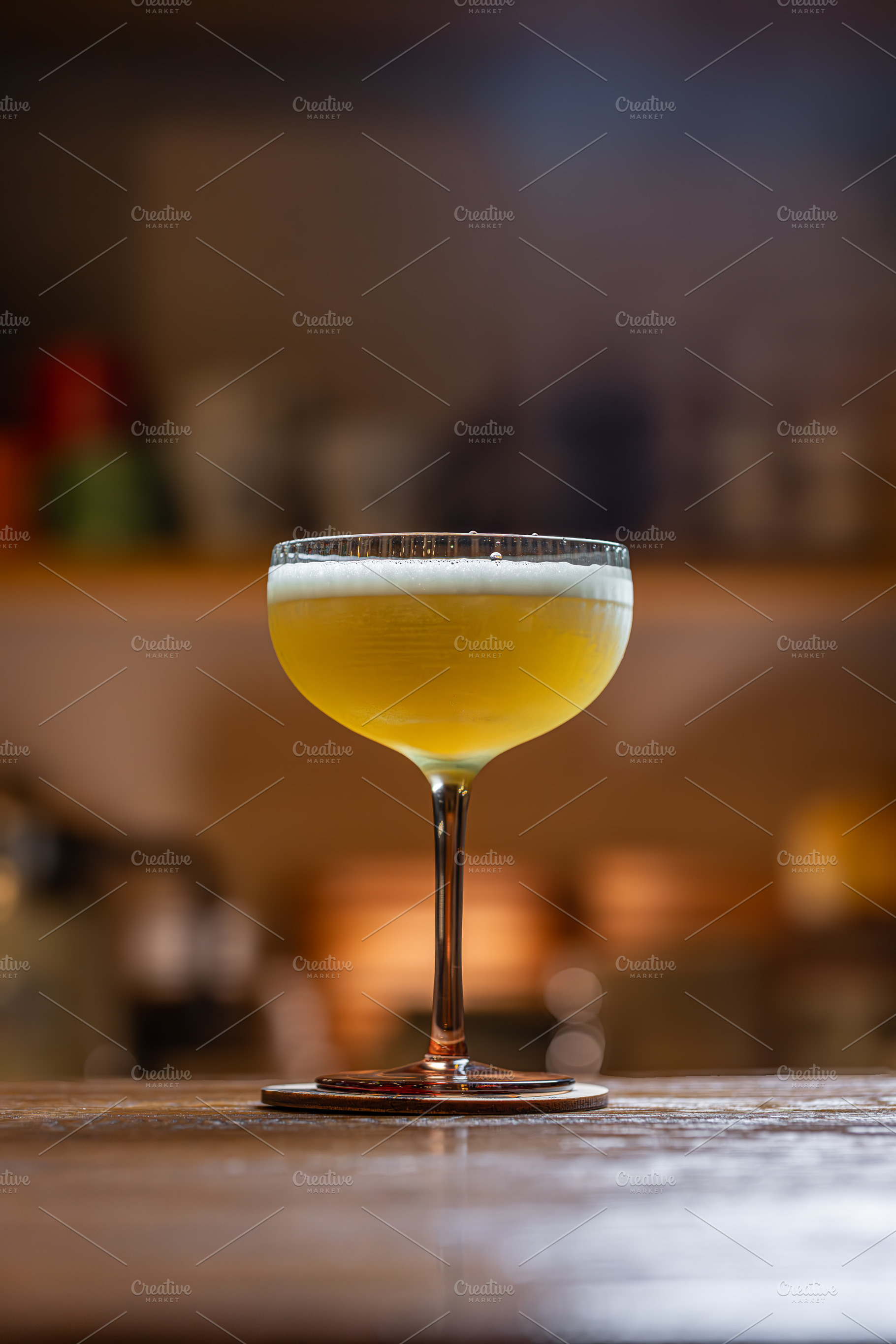 Elegant cocktail with citrus foam, a Photo by Grafvision photography