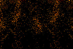 Bright sparks and glowing points of fire falling down on a black, an Abstract Photo by ndanko